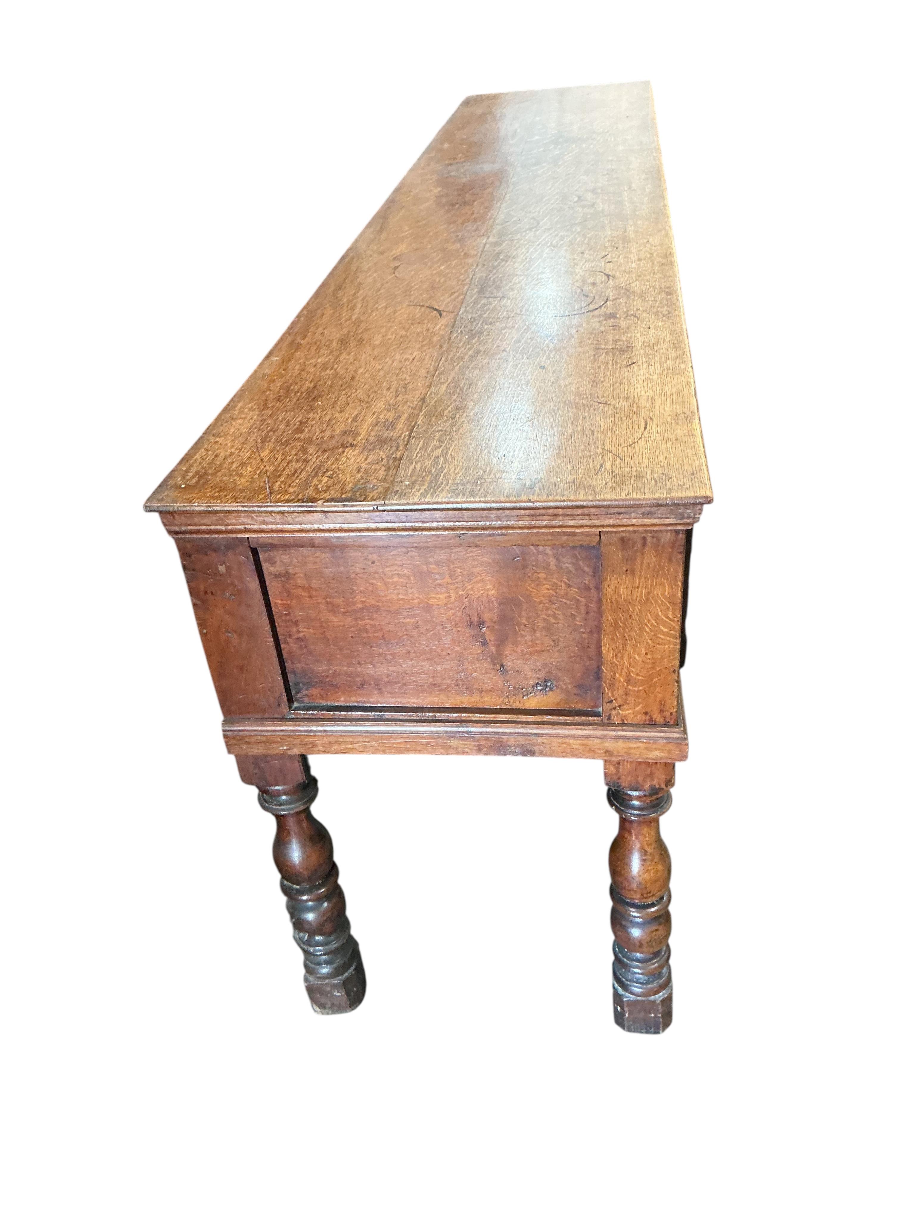A William III and later oak low dresser, width 234cm, depth 50cm, height 78cm
